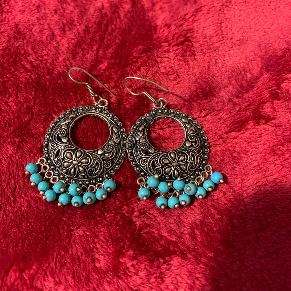 Dark ear rings with turquoise color beads